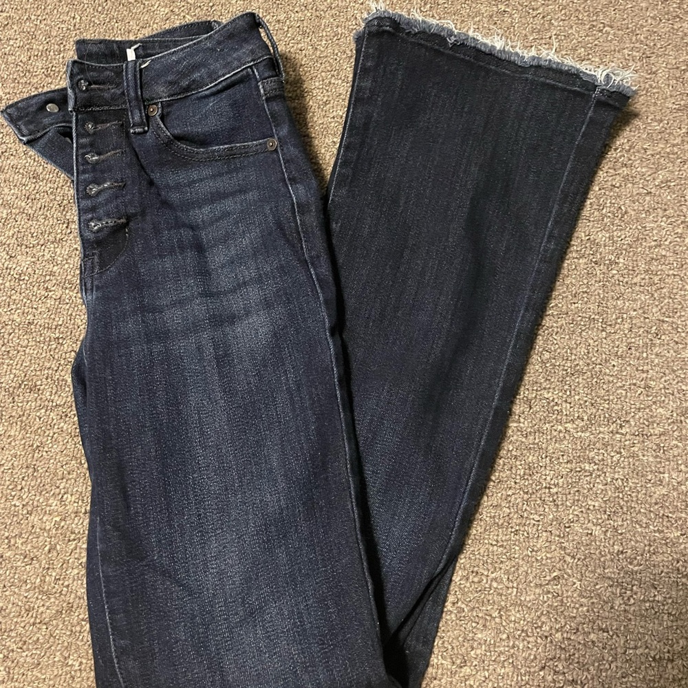 KanCan bootcut jeans with frayed bottoms